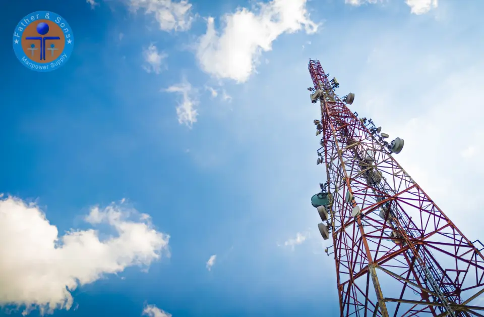 An installed telecom field tower with multiple microwave antennas installations.